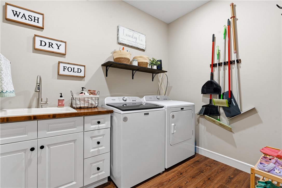 1158 Pyle Road Clarksville, OH 45113 - Photo 26 of 76 Functional laundry space featuring durable wood flooring and ample storage.