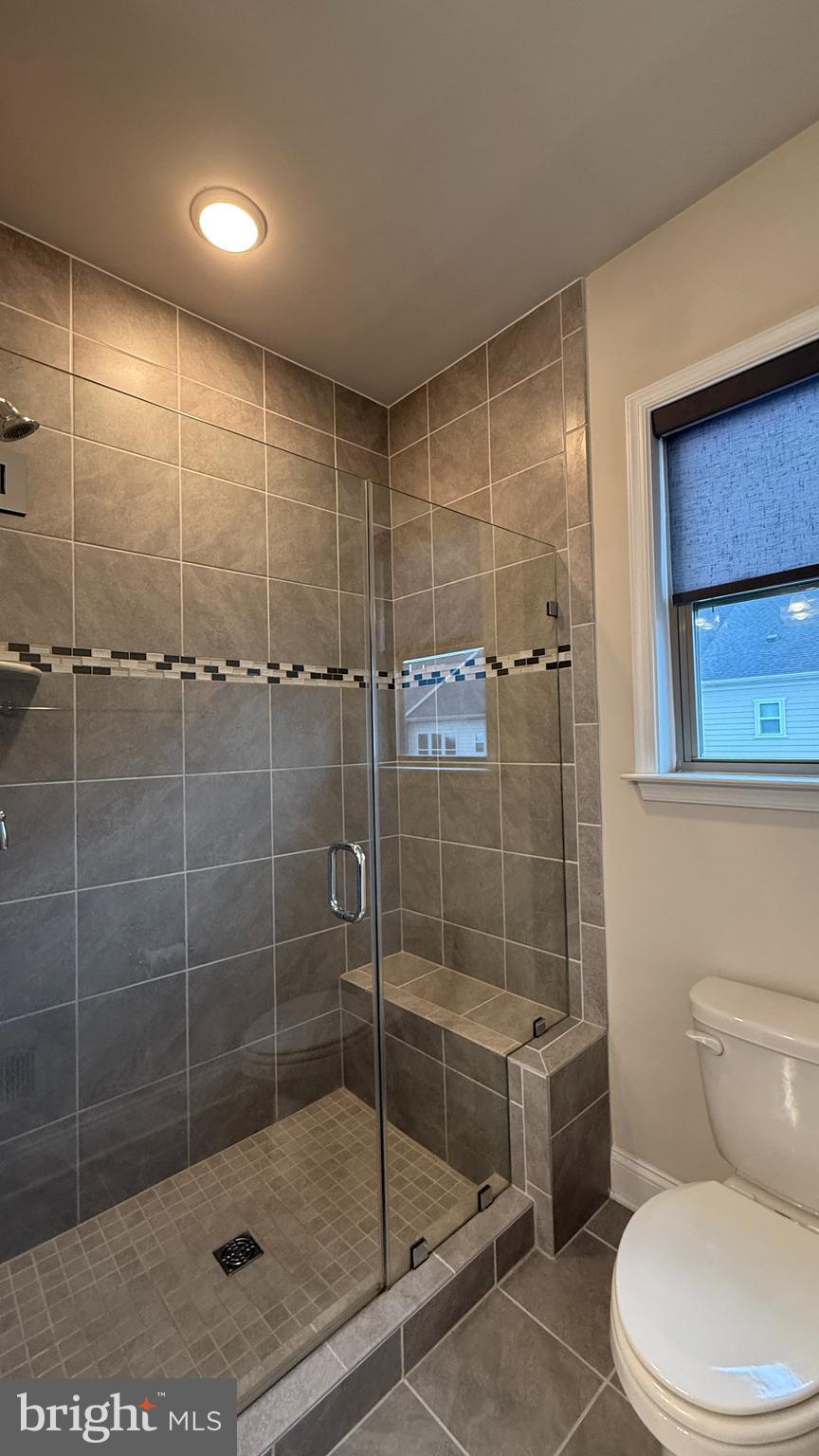 1949 Greenbriar Hall Road Dumfries, VA 22026 - Photo 15 of 26 a bathroom with a shower a toilet and sink