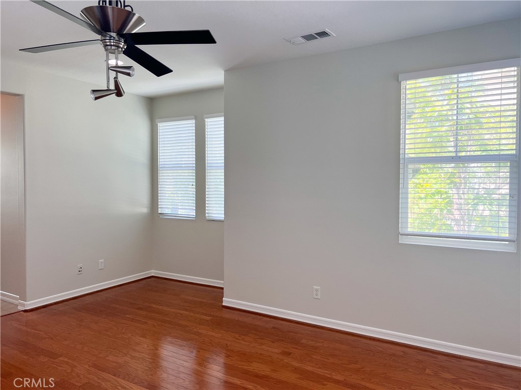 3 Paddock Place Ladera Ranch, CA 92694 - Photo 12 of 58 a view of empty room with wooden floor and fan