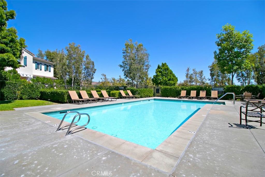 3 Paddock Place Ladera Ranch, CA 92694 - Photo 57 of 58 a view of a swimming pool with a patio and a yard