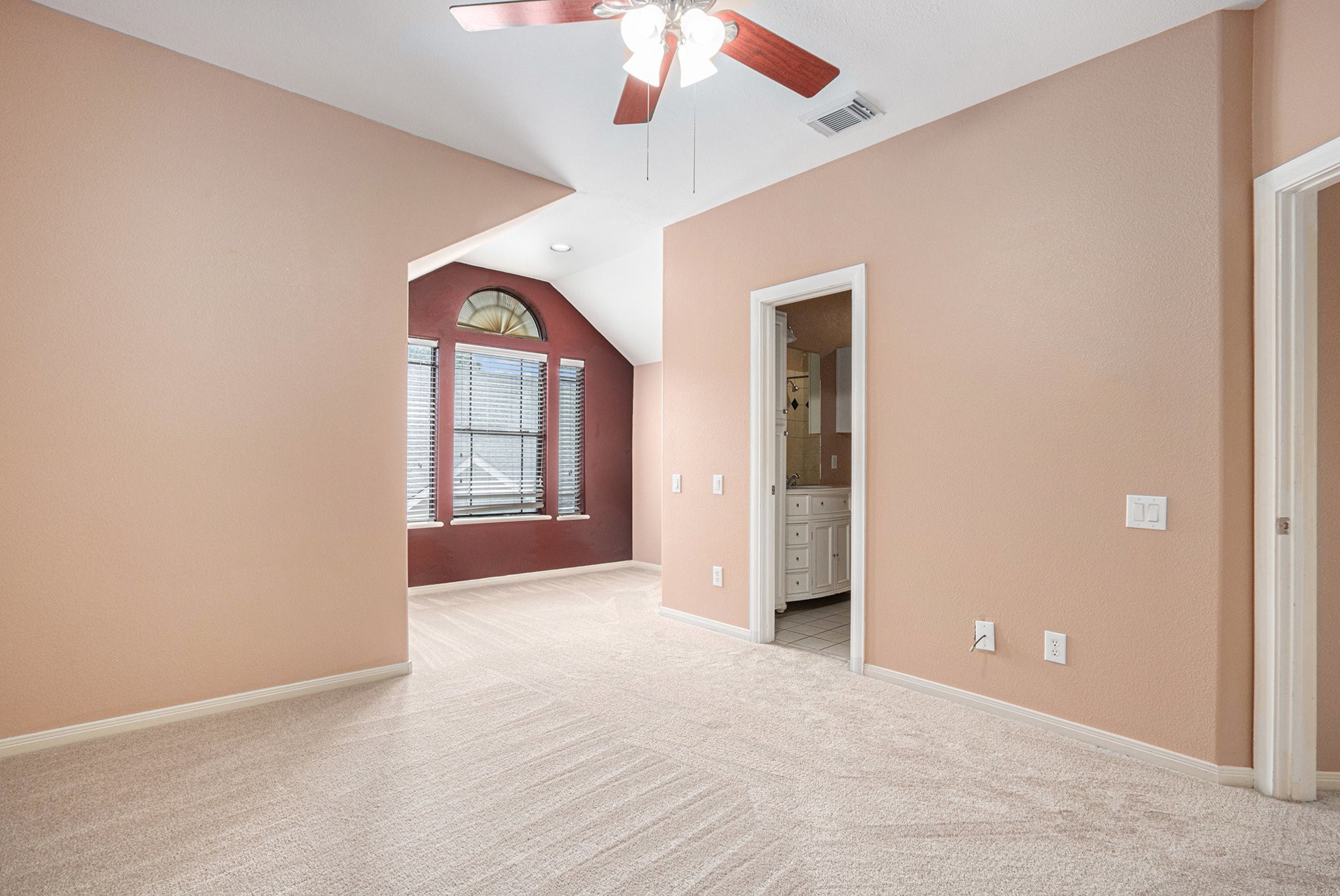2402 Calumet Street, Unit B Houston, TX 77004 - Photo 28 of 44 an empty room with chandelier fan and windows