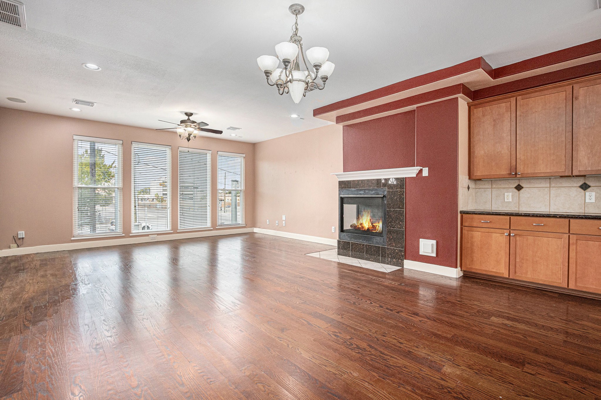 2402 Calumet Street, Unit B Houston, TX 77004 - Photo 8 of 44 a view of an empty room with wooden floor and a window
