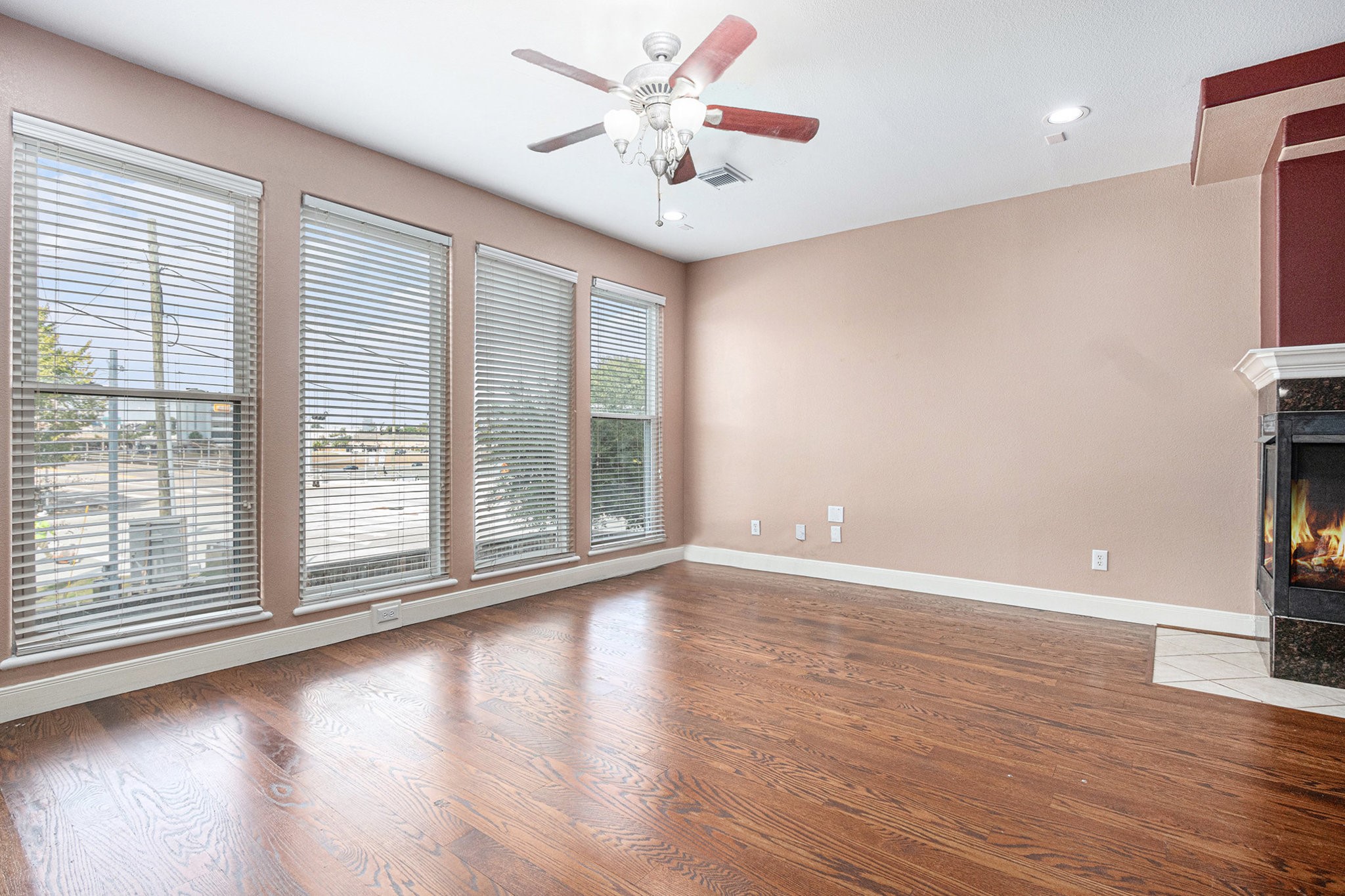 2402 Calumet Street, Unit B Houston, TX 77004 - Photo 10 of 44 a view of an empty room with wooden floor and a window