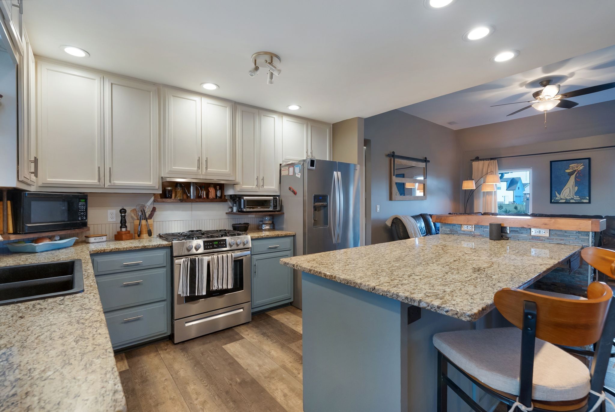485 Rigney Road Manchester, TN 37355 - Photo 18 of 61 a kitchen with stainless steel appliances granite countertop a stove top oven a sink dishwasher a dining table and chairs