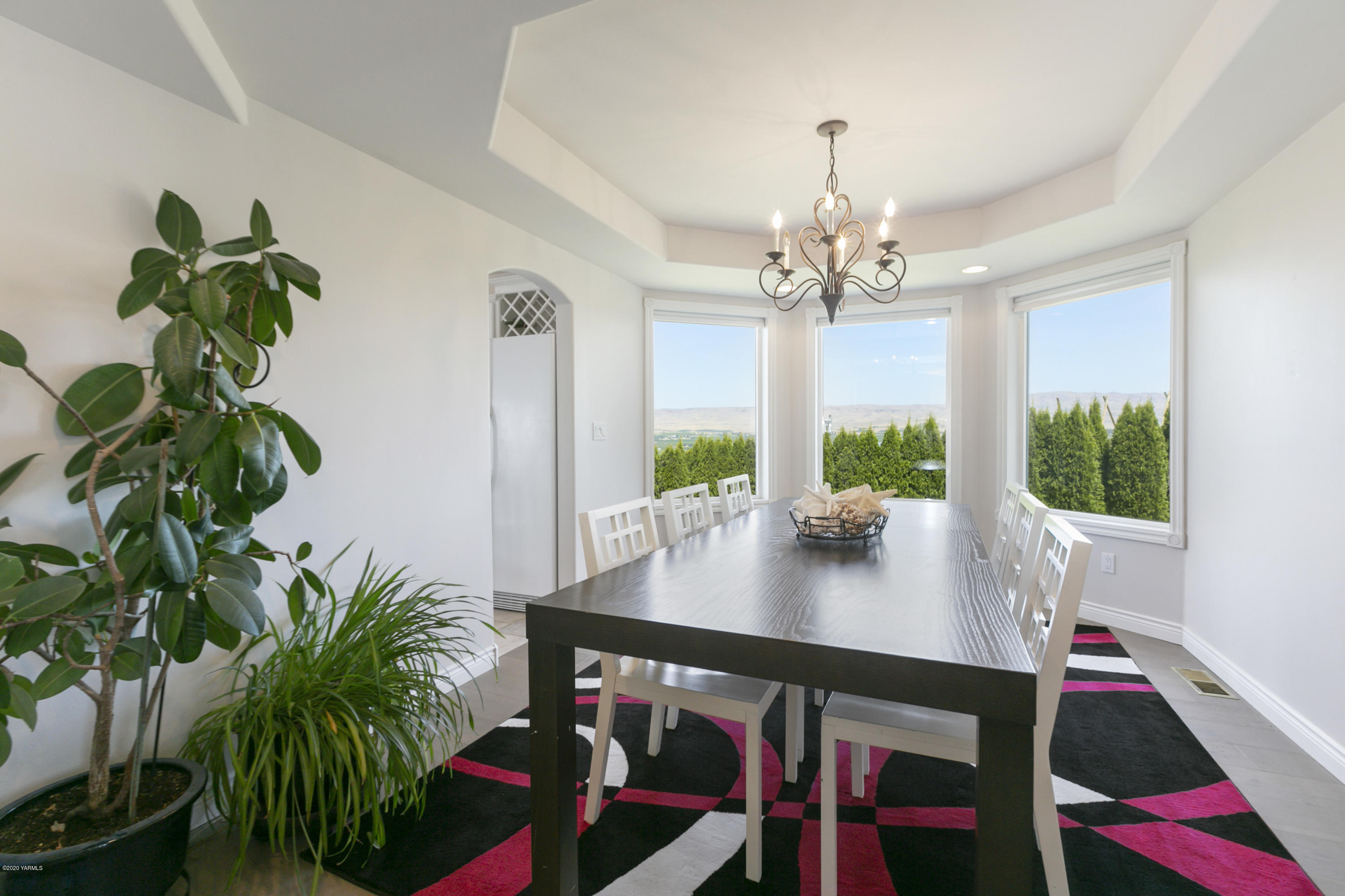 229 Konnowac Pass Road Moxee, WA 98936 - Photo 12 of 25 a view of a dining room with furniture window and wooden floor