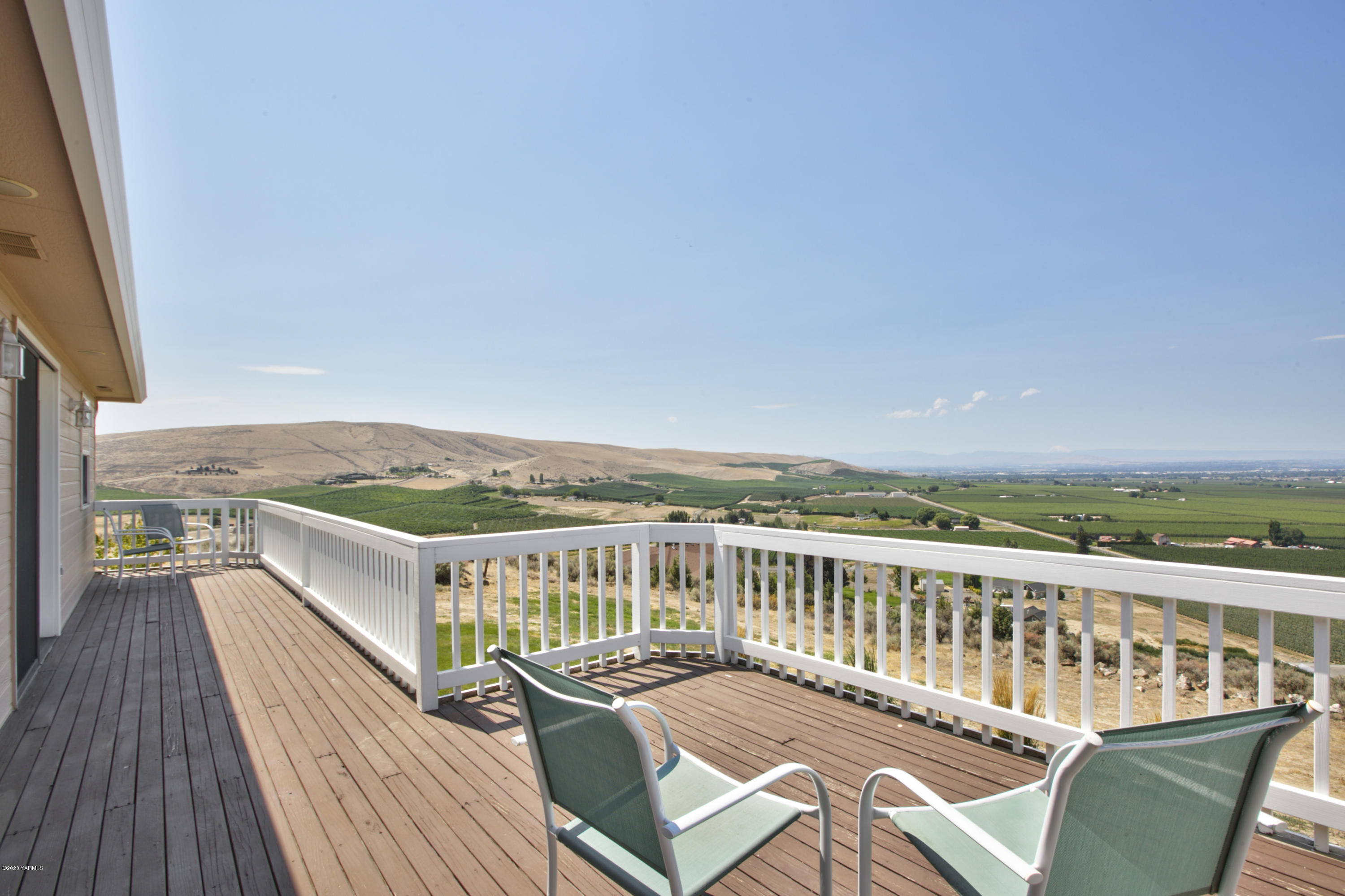 229 Konnowac Pass Road Moxee, WA 98936 - Photo 25 of 25 a view of a balcony with wooden floor and a terrace