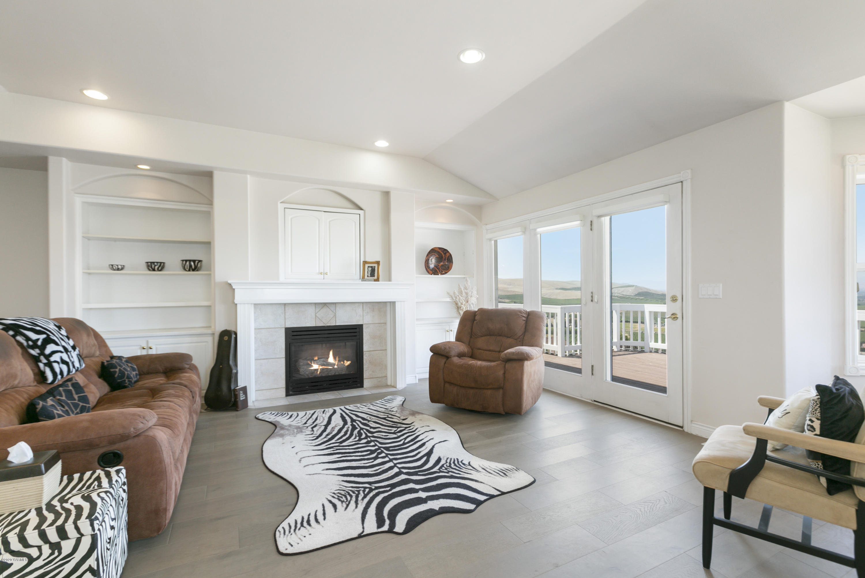 229 Konnowac Pass Road Moxee, WA 98936 - Photo 5 of 25 a living room with furniture and a fireplace