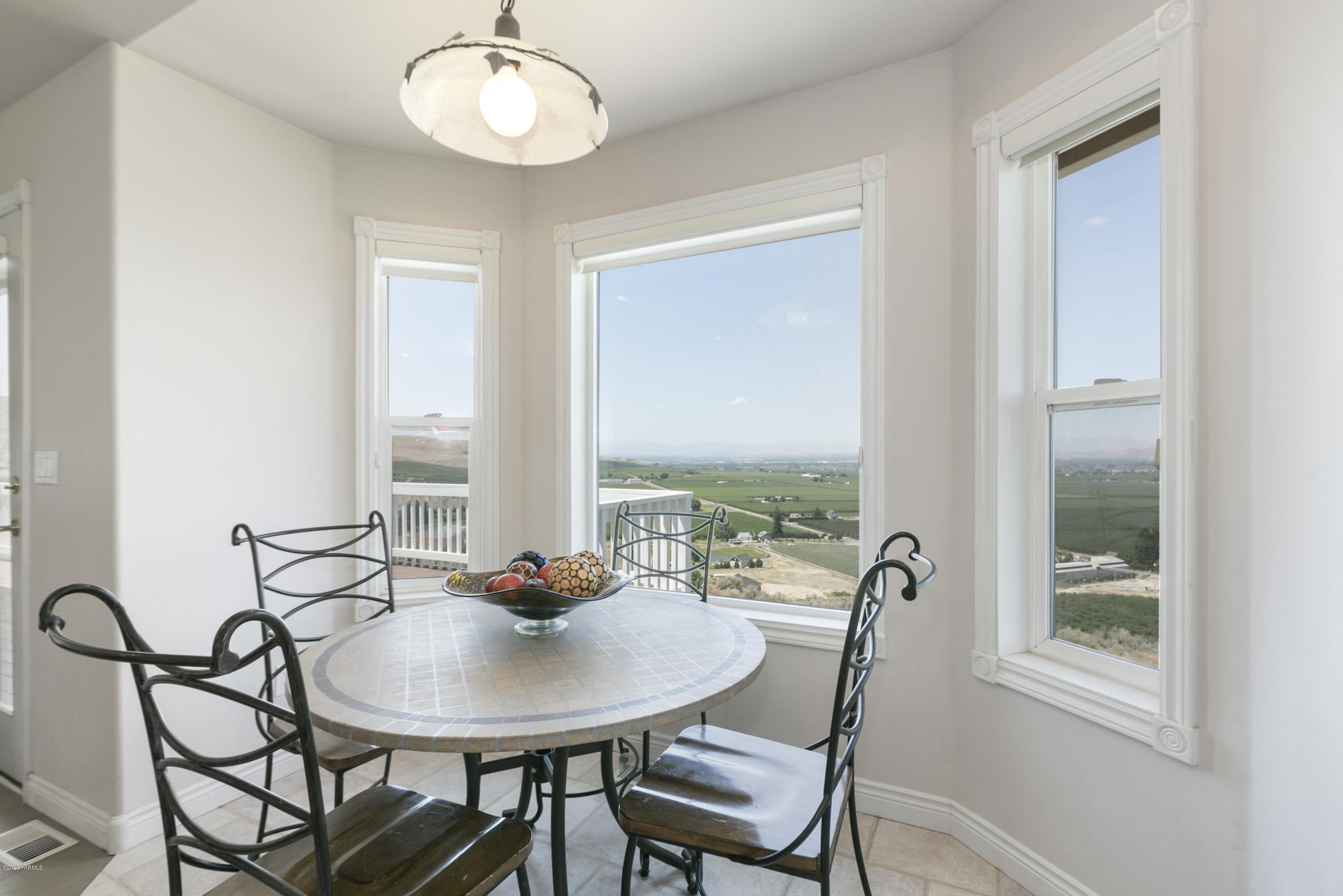 229 Konnowac Pass Road Moxee, WA 98936 - Photo 8 of 25 a view of a dining room with furniture and window
