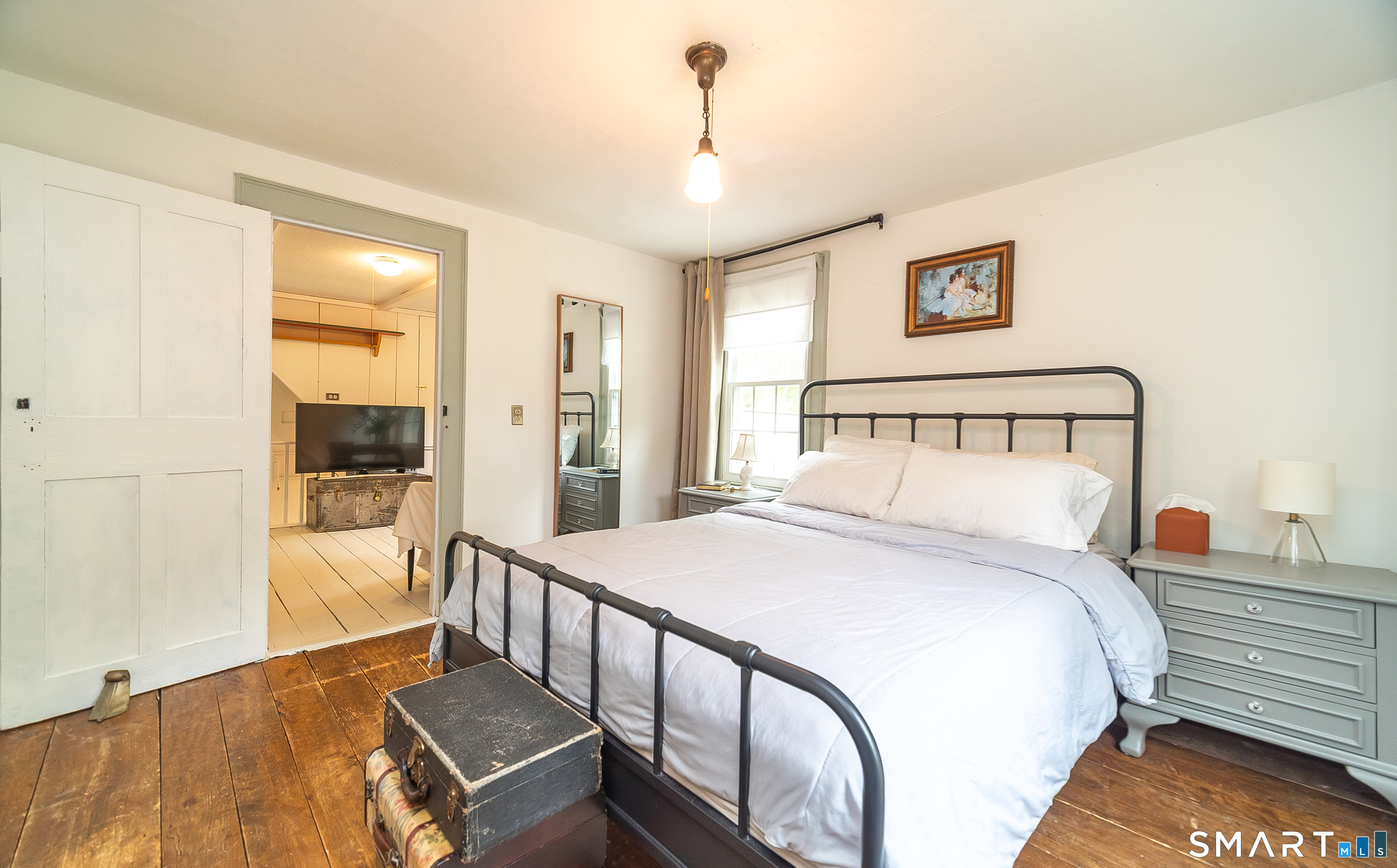 230 Killingworth Road Haddam, CT 06441 - Photo 25 of 36 a bedroom with a large bed and a chandelier