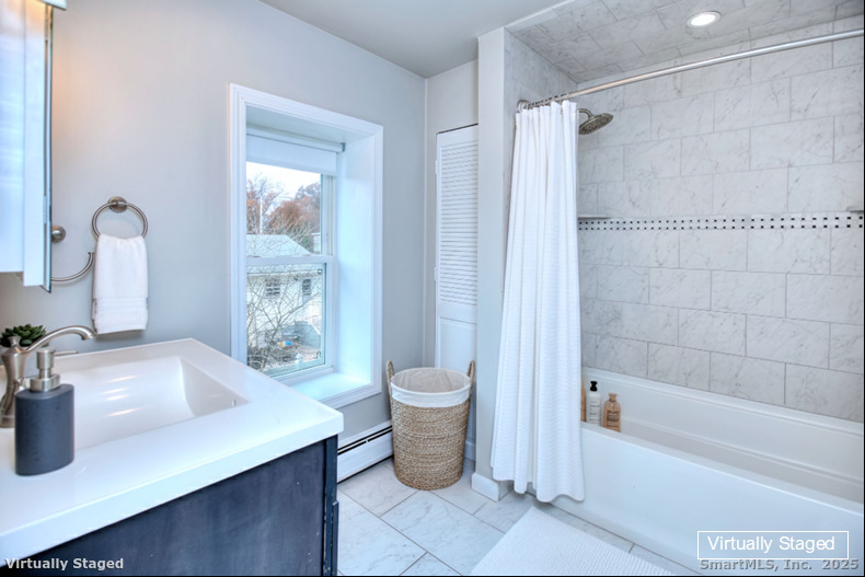 300 Soundview Avenue Fairfield, CT 06825 - Photo 15 of 28 a bathroom with a sink a toilet and shower