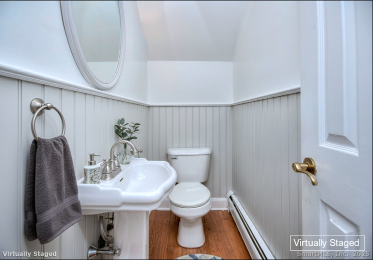 300 Soundview Avenue Fairfield, CT 06825 - Photo 16 of 28 a bathroom with a sink toilet and a mirror