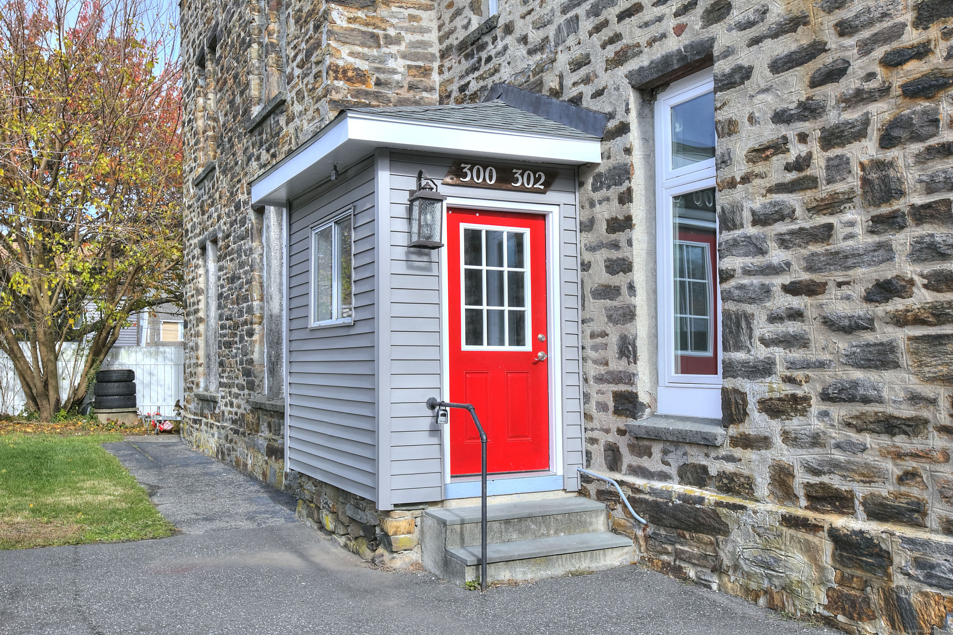 300 Soundview Avenue Fairfield, CT 06825 - Photo 2 of 28 a front view of a house with a garage