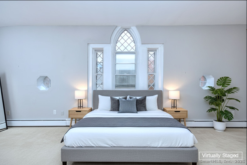 300 Soundview Avenue Fairfield, CT 06825 - Photo 24 of 28 a bedroom with a bed and a window