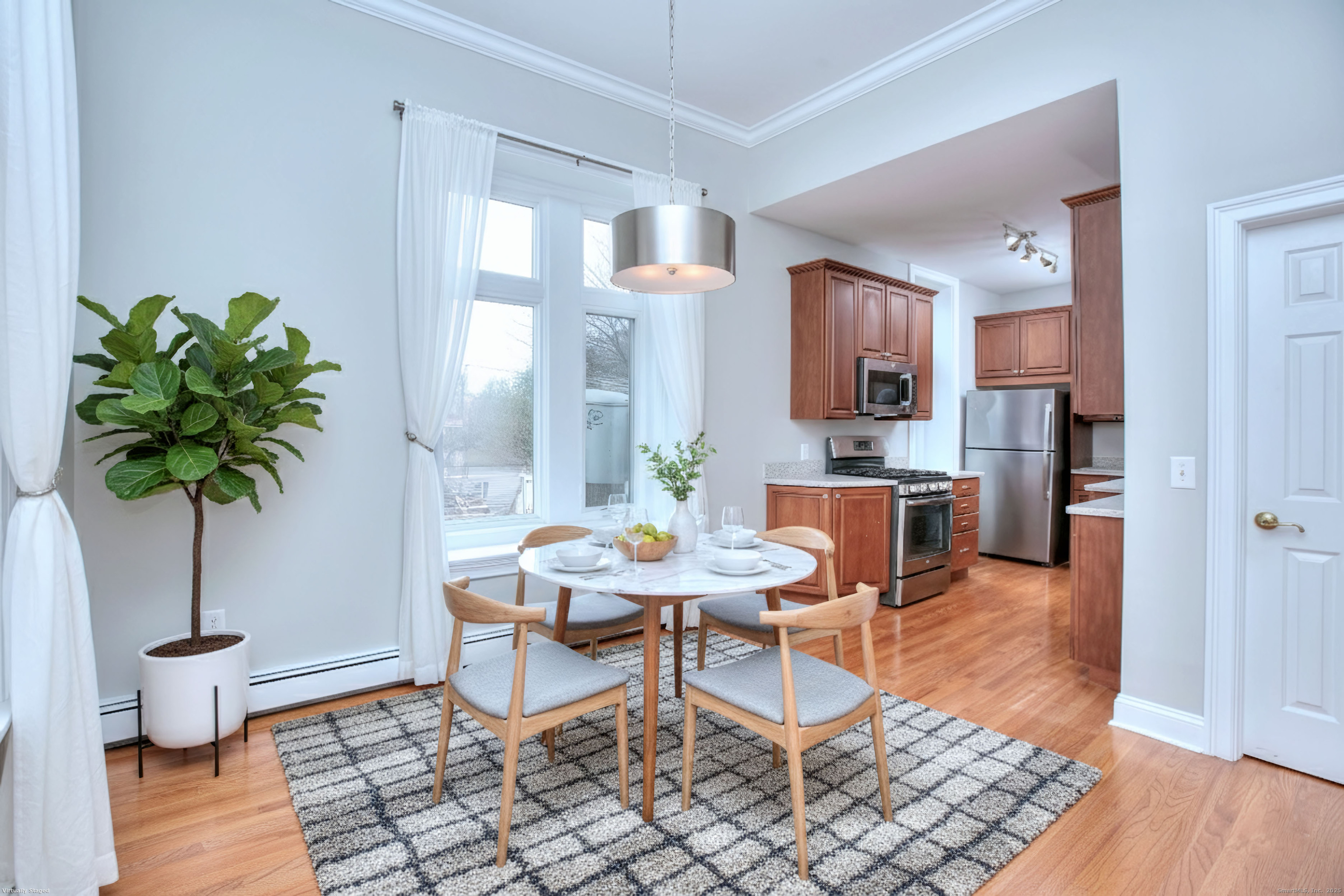 300 Soundview Avenue Fairfield, CT 06825 - Photo 9 of 28 a living room with furniture and a potted plant