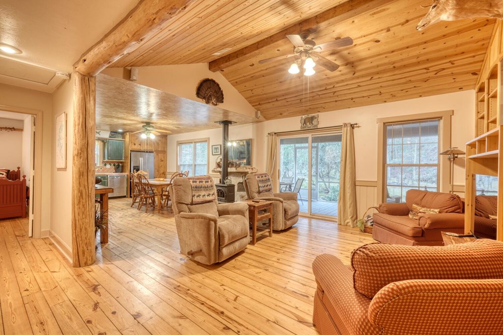 4868 Swallows Creek Road Hiawassee, GA 30546 - Photo 13 of 59 a living room with furniture and a large window