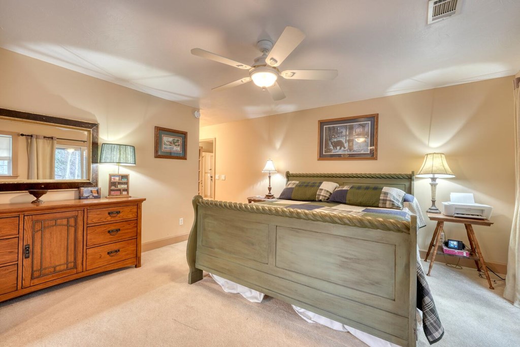 4868 Swallows Creek Road Hiawassee, GA 30546 - Photo 23 of 59 a living room with furniture and a flat screen tv