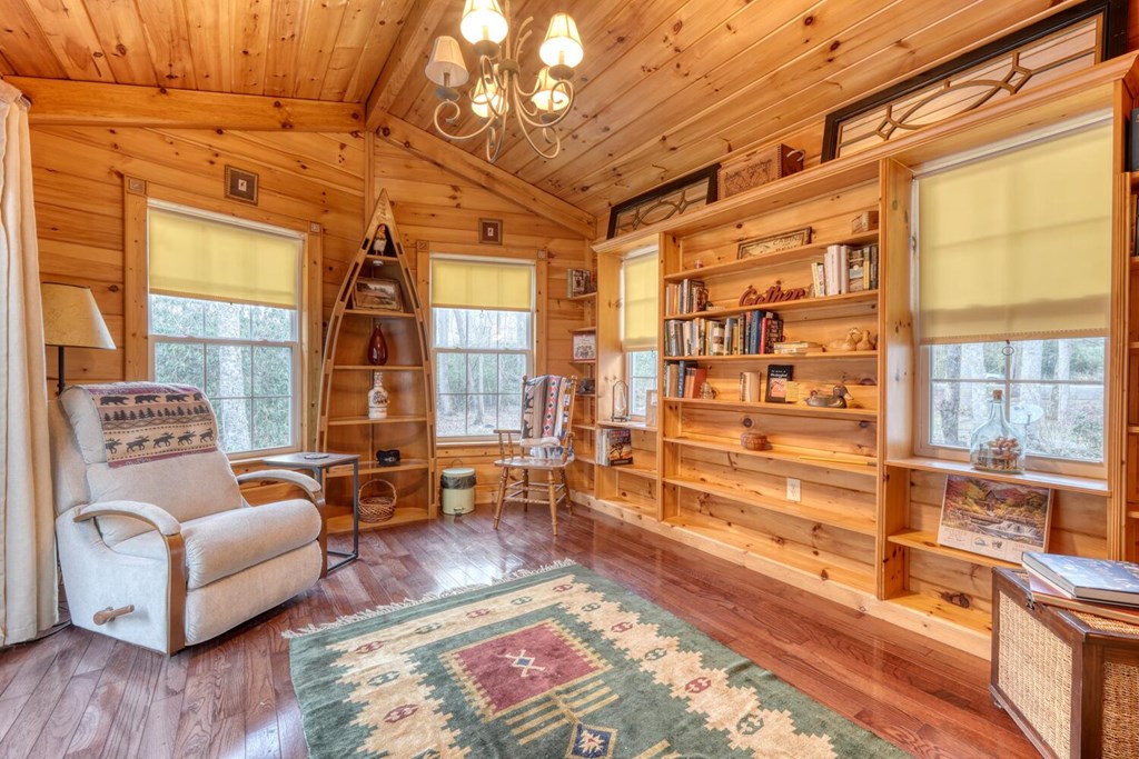 4868 Swallows Creek Road Hiawassee, GA 30546 - Photo 24 of 59 a living room with furniture or couch and a large window