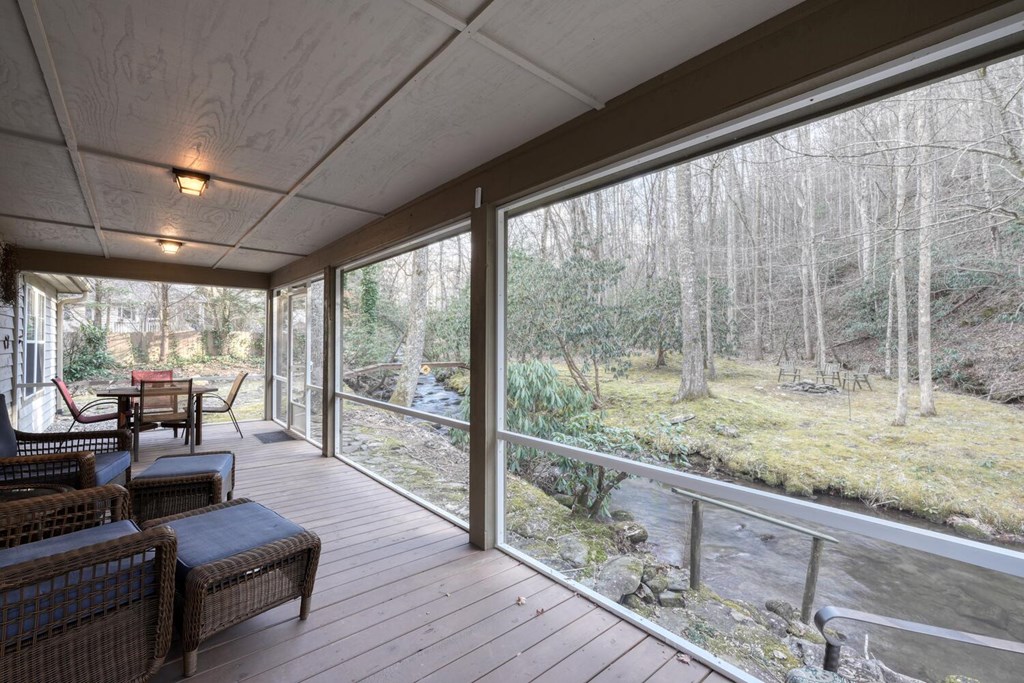 4868 Swallows Creek Road Hiawassee, GA 30546 - Photo 36 of 59 a living room with furniture and wooden floor