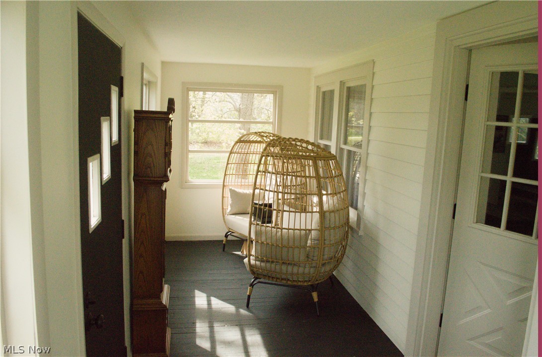 3187 Grenfall Road Barberton, OH 44203 - Photo 14 of 17 Bright and inviting interior space featuring white walls, dark flooring, and windows that provide natural light