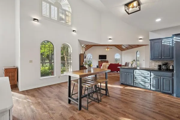 a view of a dining room with furniture window and wooden floor