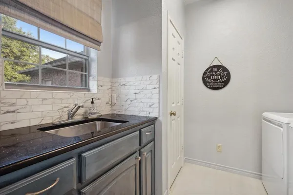 a kitchen with a sink and a cabinets