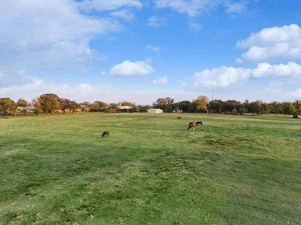 a view of a lake with houses in the back