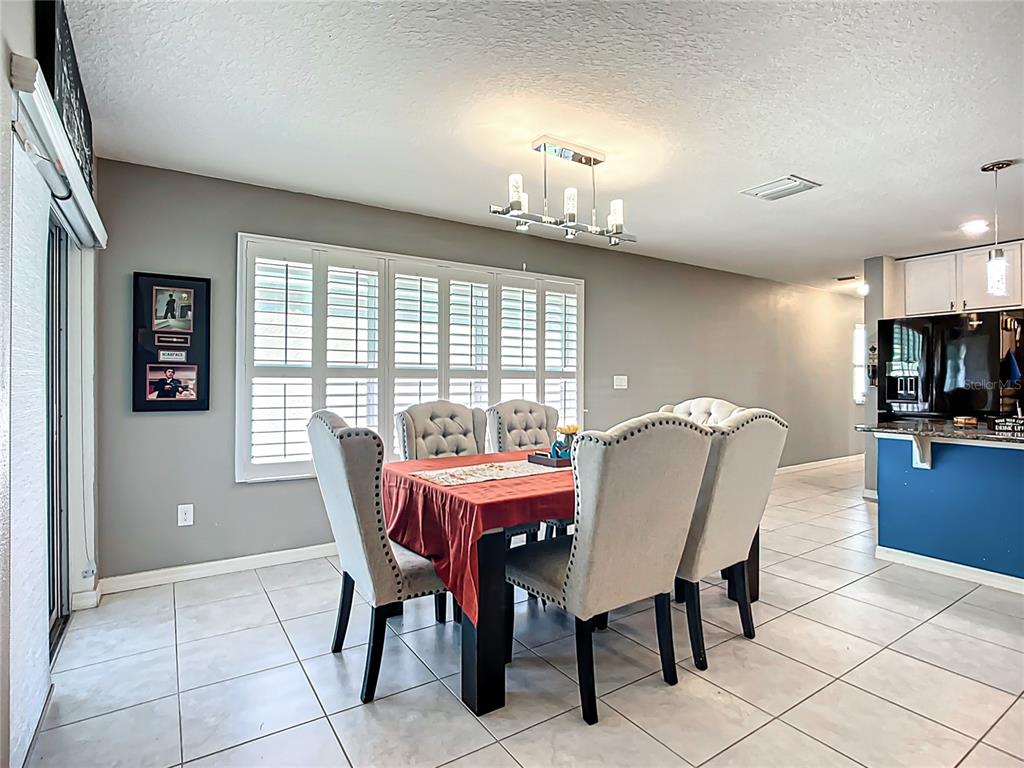 7707 Sunshine Bridge Avenue Gibsonton, FL 33534 - Photo 12 of 33 a dining room with furniture and window
