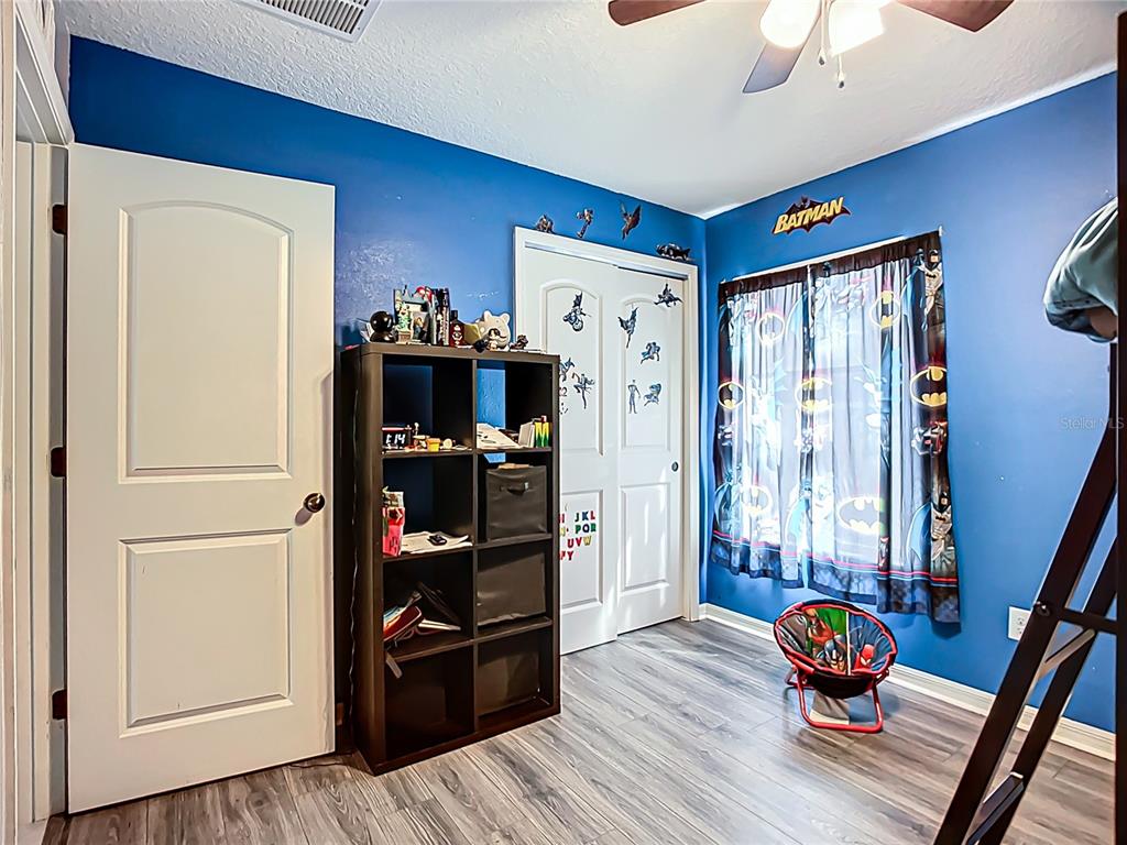 7707 Sunshine Bridge Avenue Gibsonton, FL 33534 - Photo 23 of 33 a living room with furniture and wooden floor