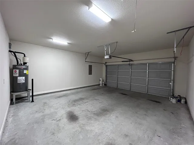 a view of a house with a garage and balcony