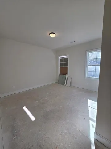 a view of empty room with windows