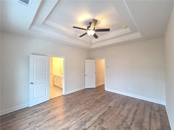 a spacious bathroom with a double vanity sink and a mirror