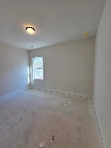 a view of a room with wooden floor and balcony