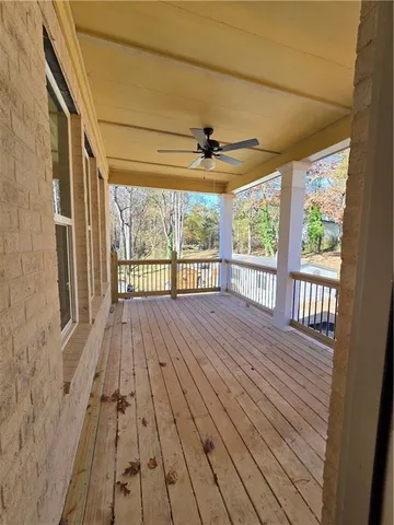 a view of a porch with wooden floor