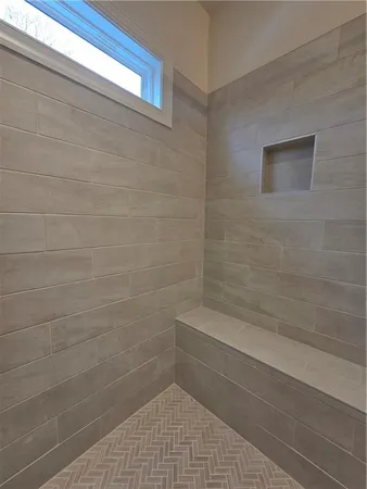 a spacious bathroom with a double vanity sink and a mirror