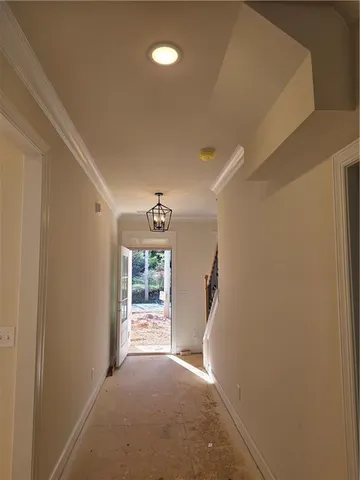 a view of kitchen with kitchen island a sink stainless steel appliances and cabinets