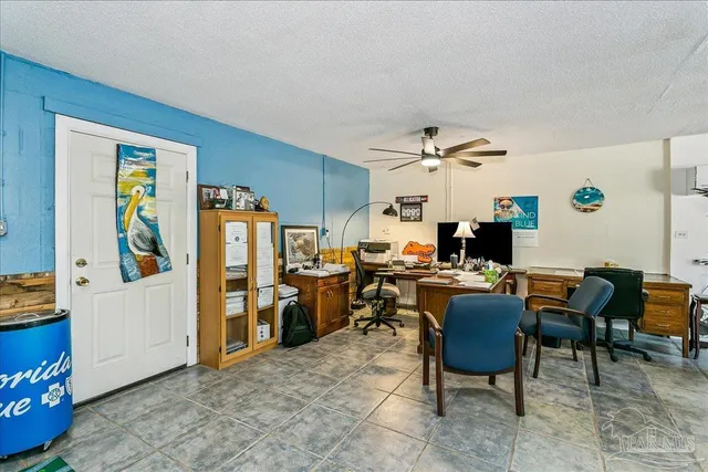 a view of a workspace with furniture