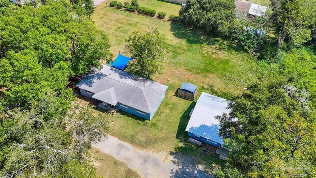 a view of a yard with chairs