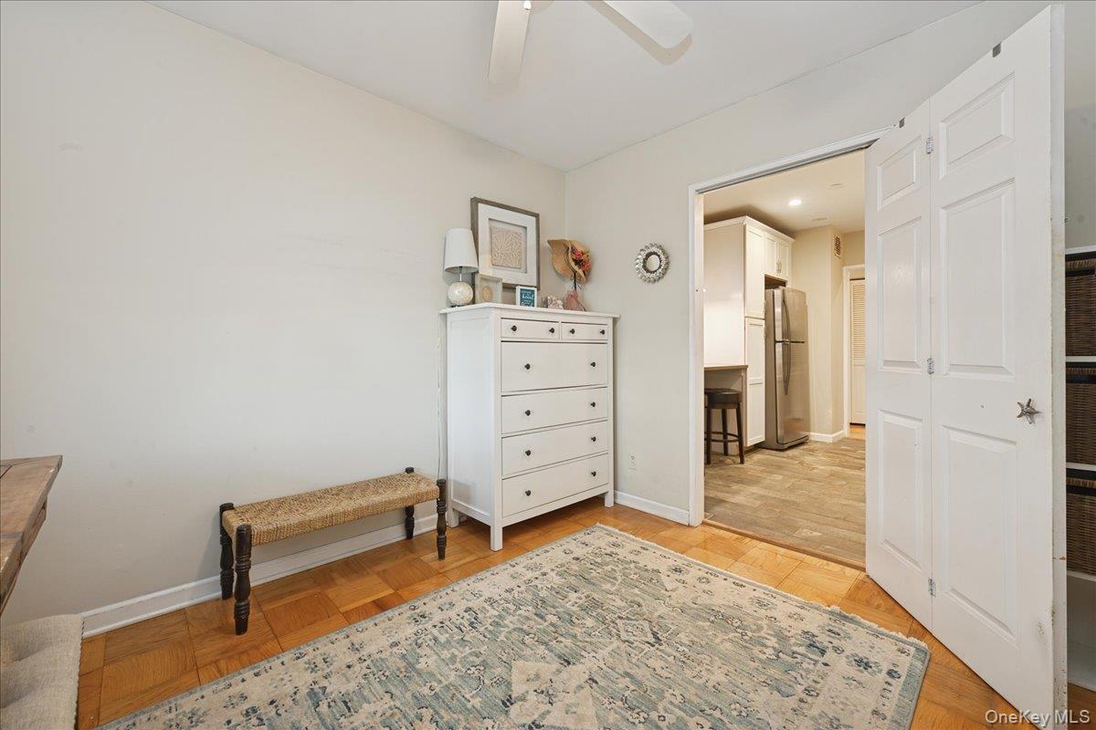 700 Shore Road, Unit 4O Long Beach, NY 11561 - Photo 18 of 42 a view of a bedroom with furniture and wooden floor