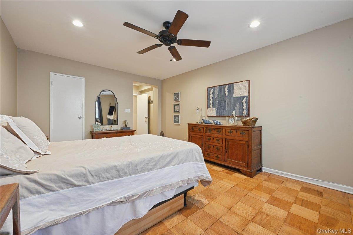 700 Shore Road, Unit 4O Long Beach, NY 11561 - Photo 23 of 42 a bedroom with a bed and dresser