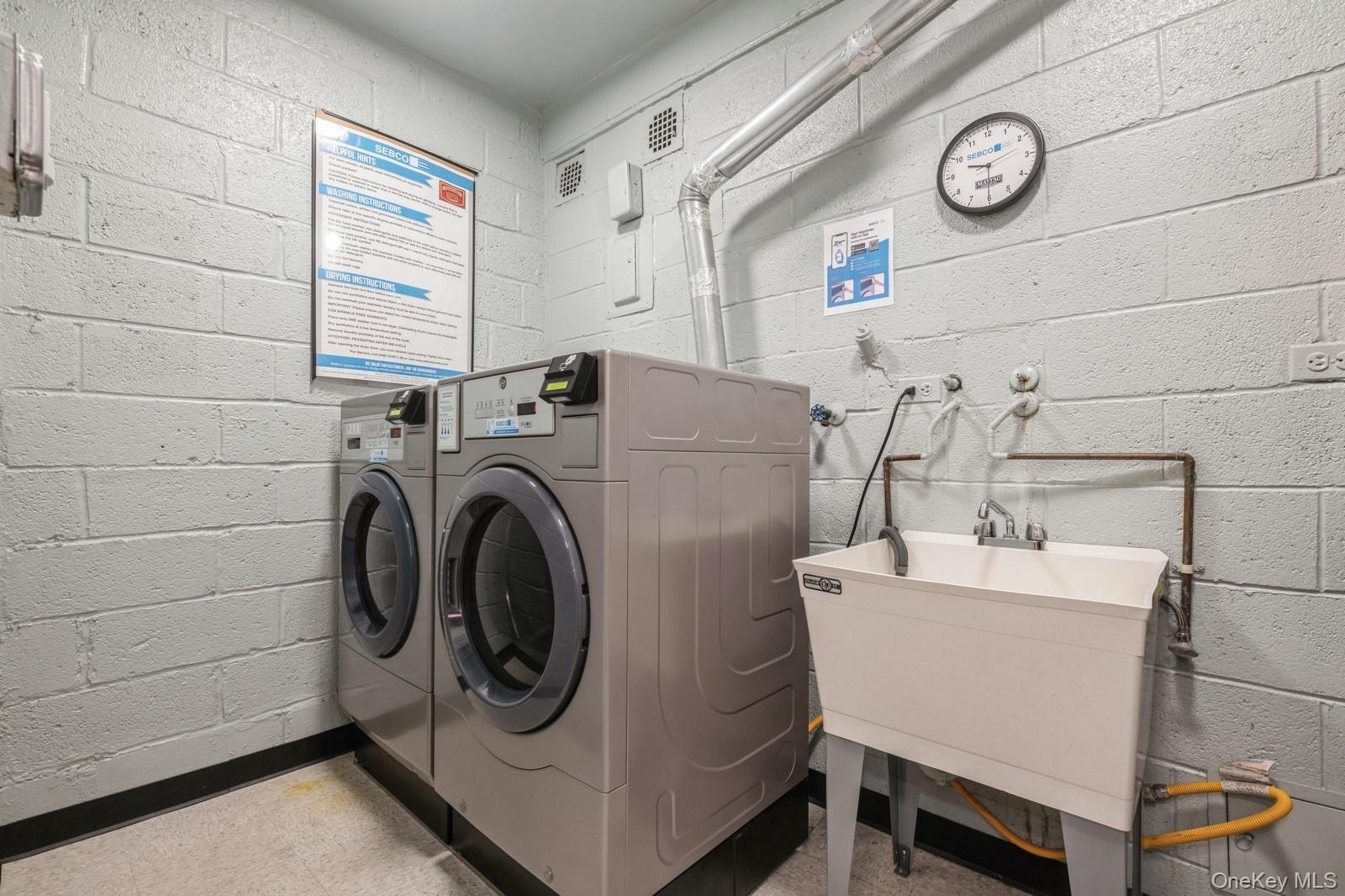 700 Shore Road, Unit 4O Long Beach, NY 11561 - Photo 32 of 42 a utility room with dryer and washer