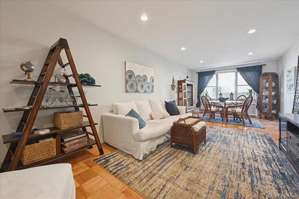 700 Shore Road, Unit 4O Long Beach, NY 11561 - Photo 6 of 42 a living room with furniture and a wooden floor