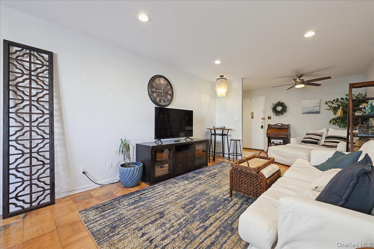 700 Shore Road, Unit 4O Long Beach, NY 11561 - Photo 9 of 42 a living room with furniture and a flat screen tv
