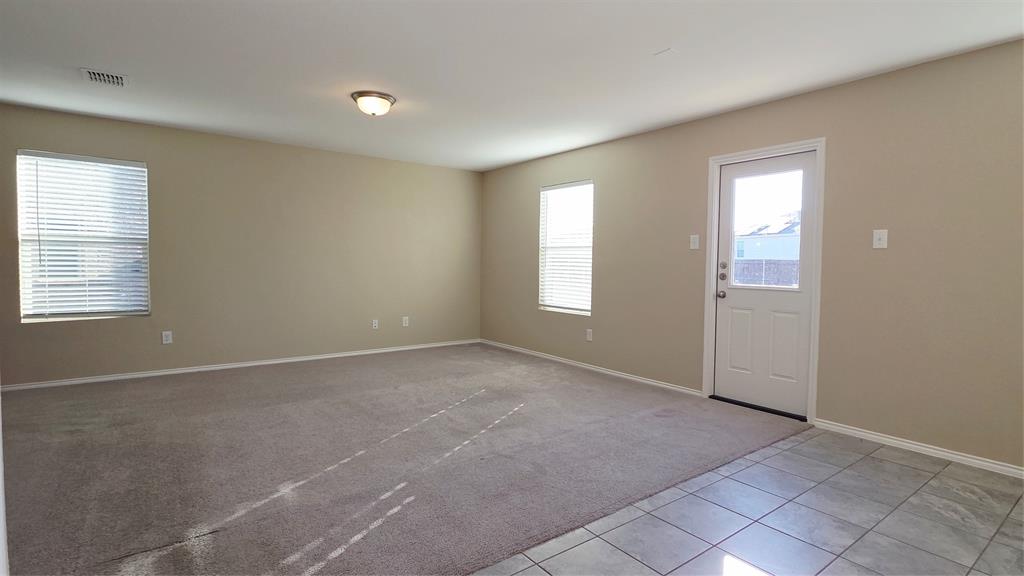 1804 Arcola Court Forney, TX 75126 - Photo 11 of 27 an empty room with windows