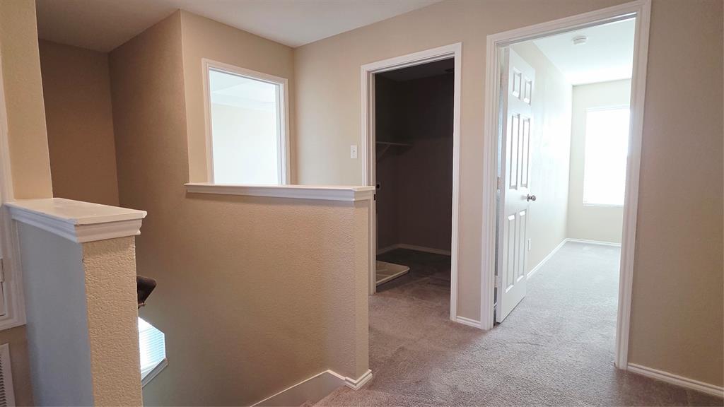 1804 Arcola Court Forney, TX 75126 - Photo 17 of 27 a view of hallway with sink and a window