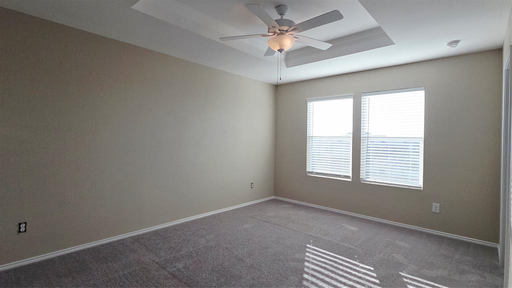 1804 Arcola Court Forney, TX 75126 - Photo 20 of 27 an empty room with a window and a fan
