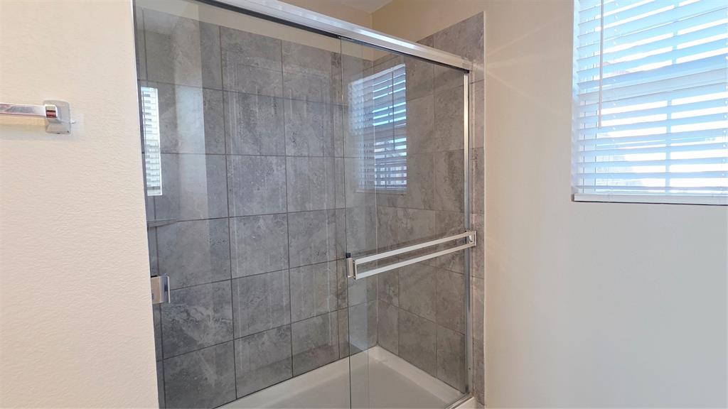 1804 Arcola Court Forney, TX 75126 - Photo 23 of 27 a bathroom with a shower