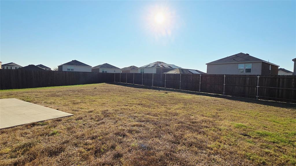 1804 Arcola Court Forney, TX 75126 - Photo 25 of 27 a view of a house with a yard and a wooden fence
