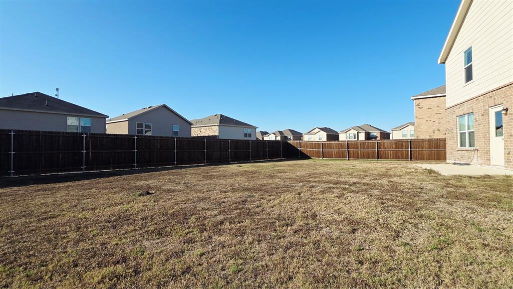 1804 Arcola Court Forney, TX 75126 - Photo 27 of 27 a view of a house with a yard