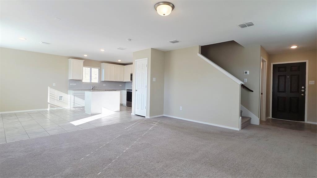 1804 Arcola Court Forney, TX 75126 - Photo 4 of 27 a view of a kitchen with a sink and cabinets