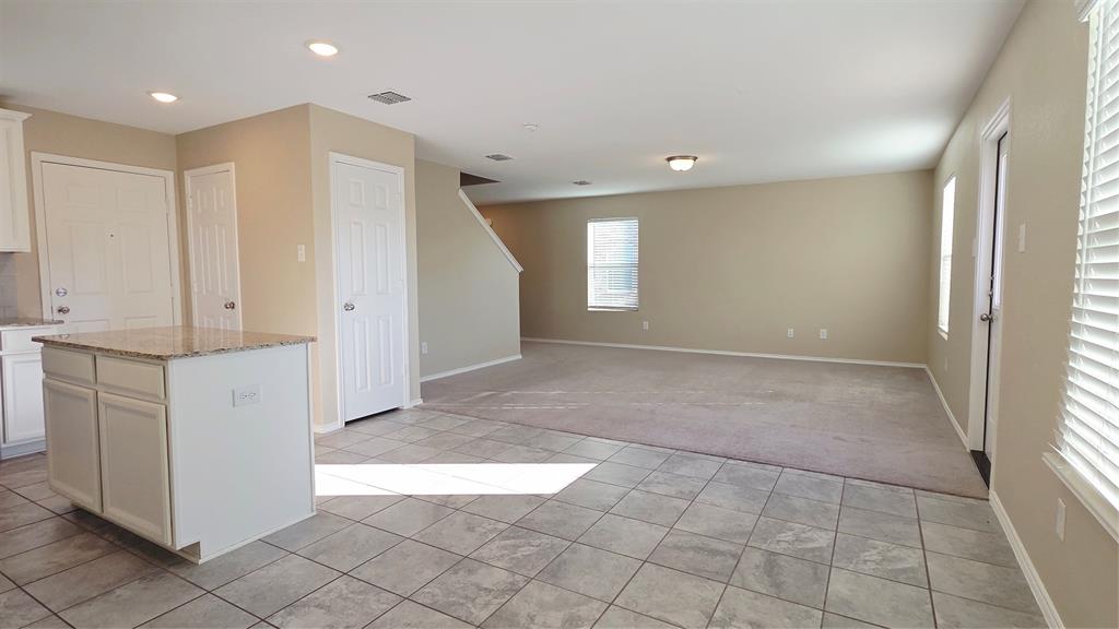 1804 Arcola Court Forney, TX 75126 - Photo 7 of 27 a view of hallway with a window and a refrigerator